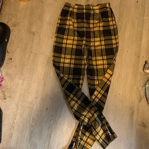 Yellow and black pants with zipper ankles